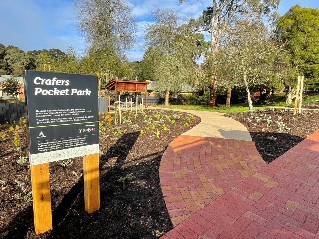 sign in front of an outdoor park