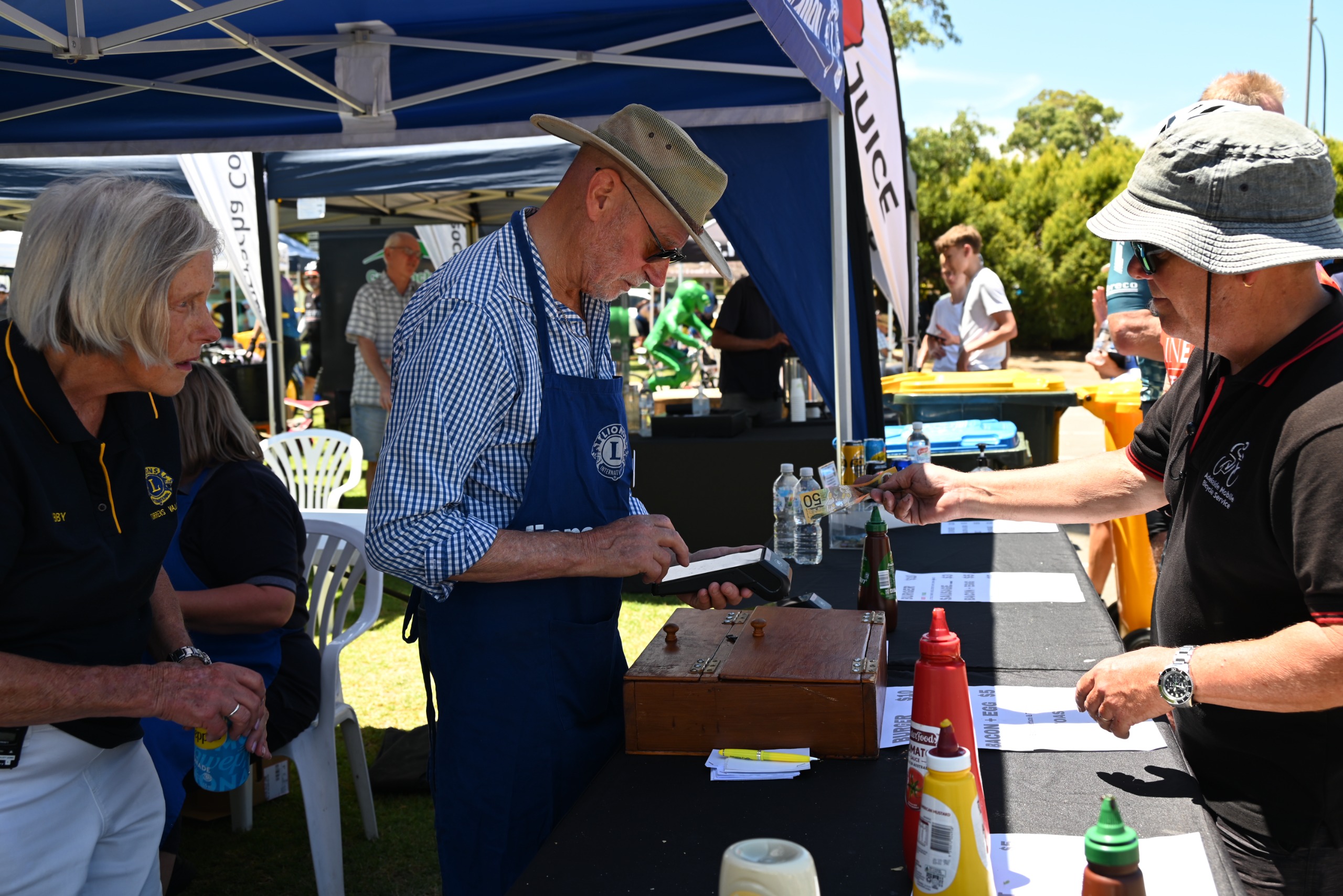 People serving barbecue food